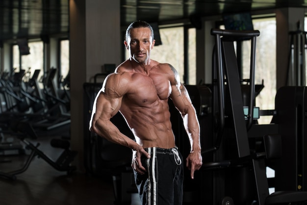 Portrait Of A Physically Fit Man In Modern Fitness Center