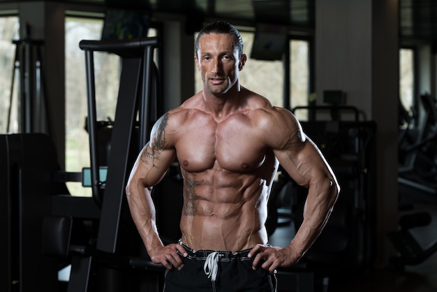 Portrait Of A Physically Fit Man In Modern Fitness Center