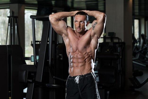 Portrait Of A Physically Fit Man In Modern Fitness Center