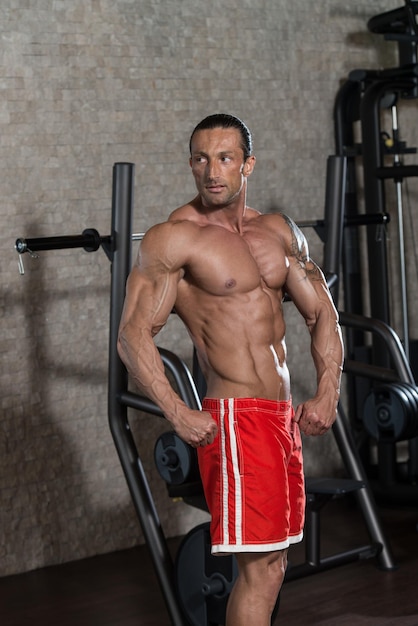 Portrait Of A Physically Fit Man In Modern Fitness Center