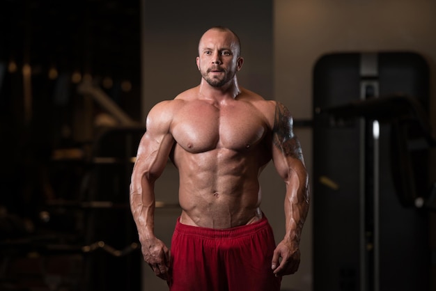 Portrait Of A Physically Fit Man Showing His Well Trained Body  Muscular Athletic Bodybuilder Fitness Model Posing After Exercises