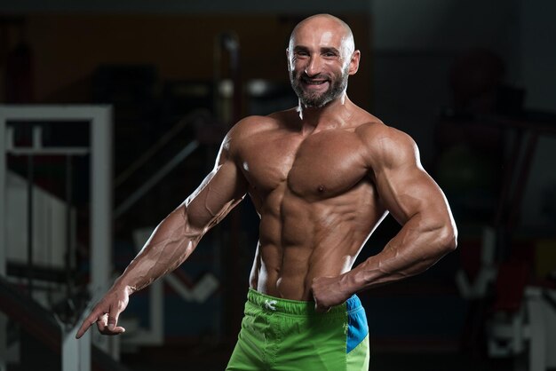 Portrait Of A Physically Fit Mature Man In A Healthy Club With Dramatic Lighting