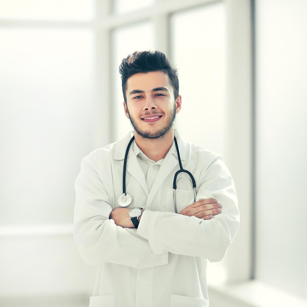 Portrait of a physician therapist on a light background . photo with copy space