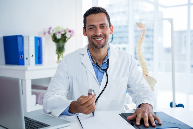 Portrait of physiotherapist holding stethoscope