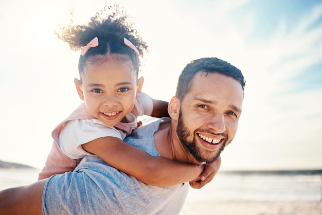 Portrait piggyback and father with girl at beach on summer holiday family vacation or travel together in Colombia Happy dad carrying young kid at sea for love tropical freedom or care in sunshine