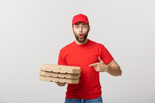 Portrait of Pizza delivery man presenting something in box.