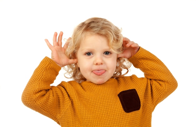 Portrait of playful small kid with long blond hair mockering