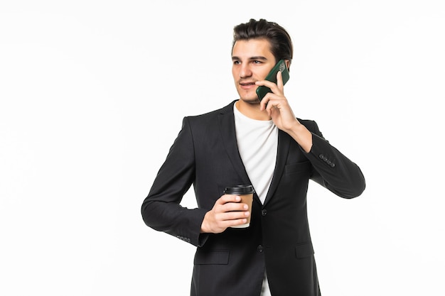 Portrait of positive agent man have work relax time hold take-out coffee mug speak on cell phone colleagues family friends wear black pants blazer jacket grey