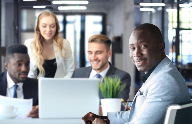 Portrait of a positive business employees at an office business meeting