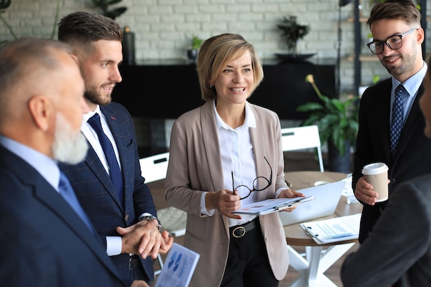 Portrait of a positive business employees at an office business meeting.