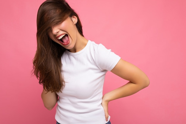 Portrait of positive cheerful fashionable woman in casual white t-shirt for mock up