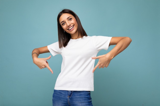 Portrait of positive happy smiling young beautiful brunette woman with sincere emotions wearing