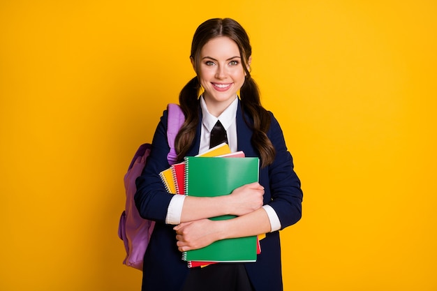 portrait of positive high school girl hold note book