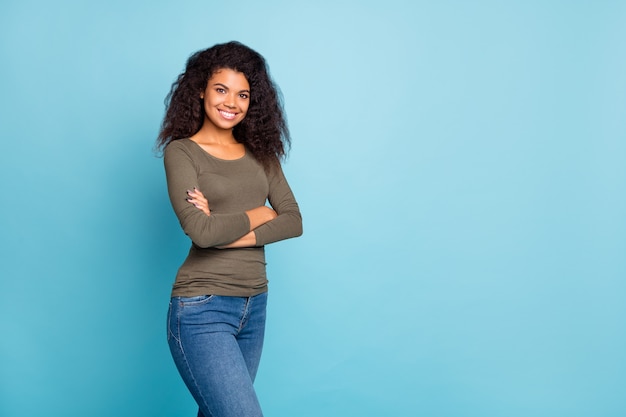 Portrait of positive independent afro american girl entrepreneur work worker cross hands true expert professional wear casual style clothing isolated over blue color wall 