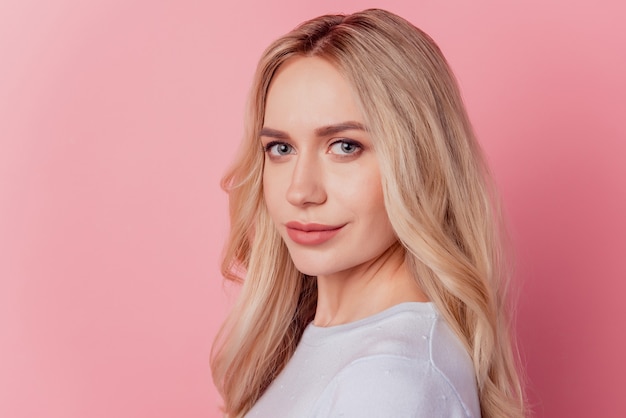 Portrait of positive lovely pretty lady look camera on pink background