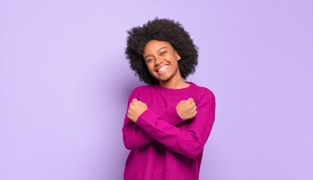 Portrait of positive young pretty black woman