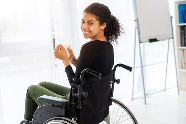 Portrait of positive young woman smiling