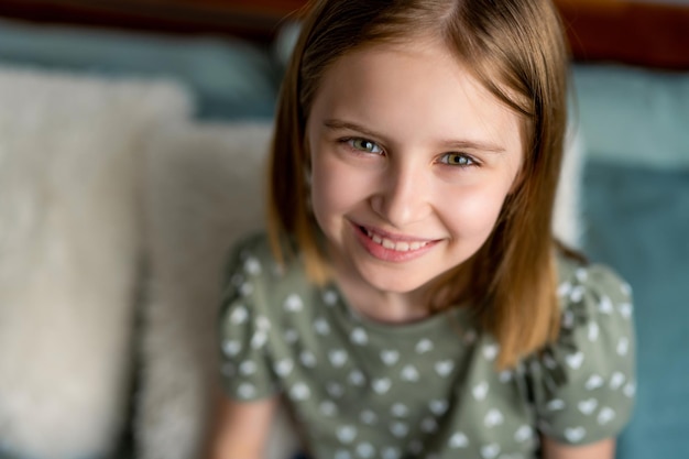 Portrait of preteen girl indoors