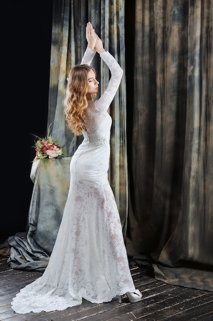 Portrait of pretty bride in wedding dress