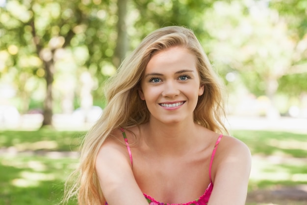 Portrait of pretty casual woman posing on a lawn