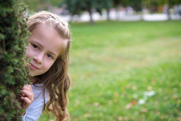 Portrait of pretty child girl outdoors.