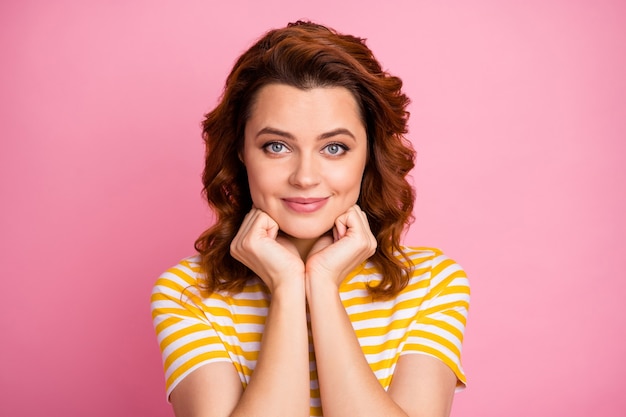 portrait of pretty girl enjoying free time isolated over pink pastel background