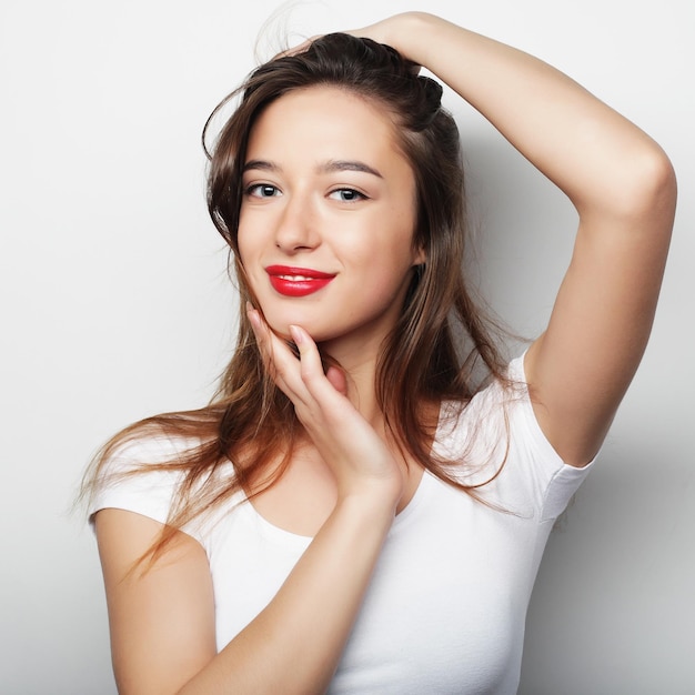 Portrait of a pretty girl on a white background