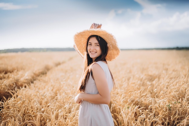 Portrait of a pretty girl who is walking around the field selective focus