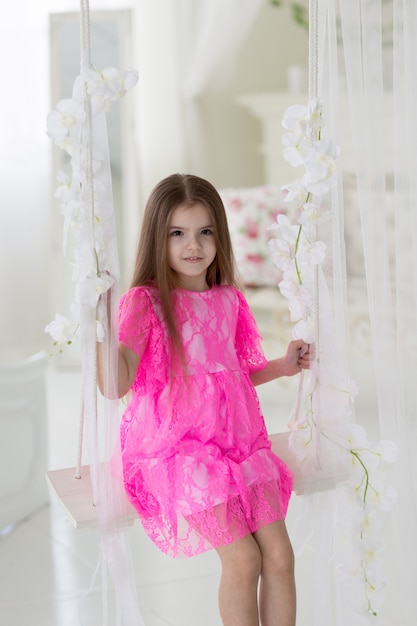 Portrait of pretty little girl in dress