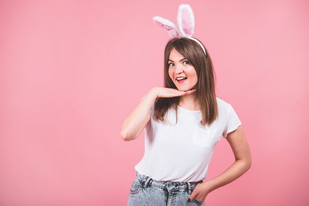 Portrait of a pretty lovely girl wearing bunny ears standing