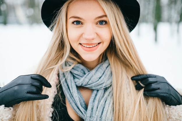 Portrait of pretty stylish smiling blonde girl