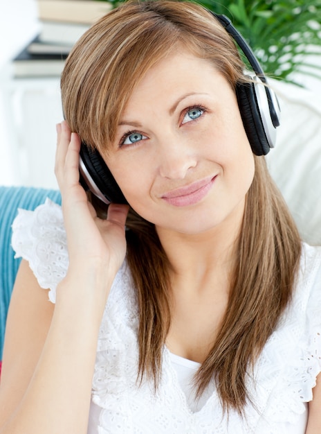 Portrait of a pretty woman listen to music with headphones 