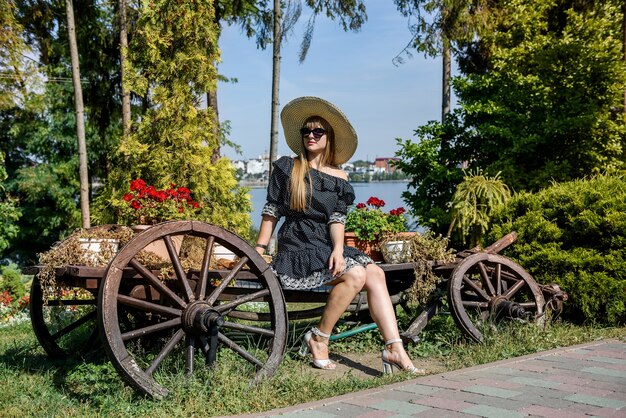 Portrait of pretty woman in summer garden, lifestyle