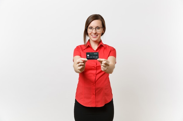 Photo portrait of pretty young business teacher woman in red shirt skirt glasses holding cedit bank card, cashless money isolated on white background. education teaching in high school university concept.