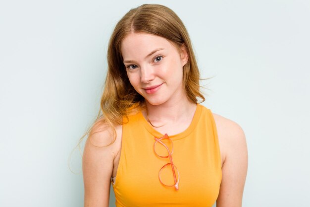 Portrait of pretty young caucasian wearing glasses woman isolated on blue background