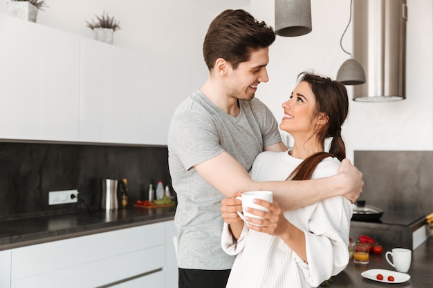 Portrait of a pretty young couple drinking coffee