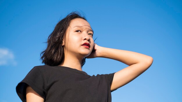 Portrait of a pretty young girl posing outdoors