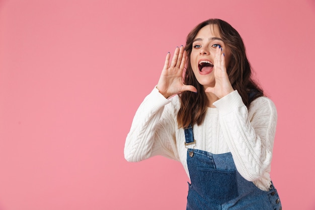 Portrait of a pretty young woman shouting loud