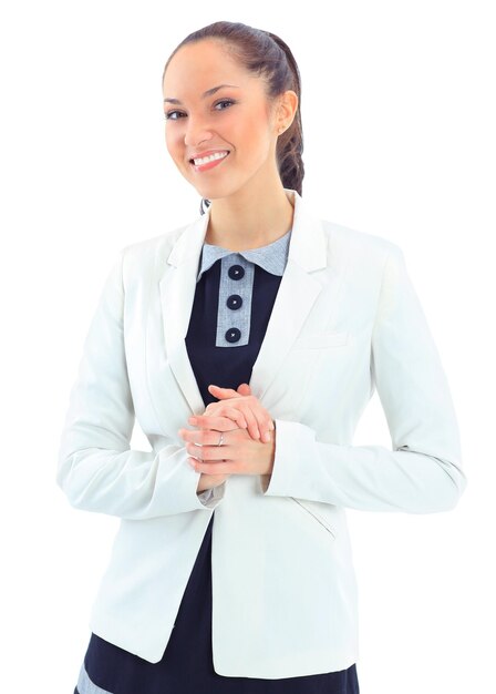 Portrait of a pretty young woman standing with folded hands on white background