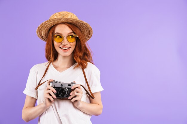 Portrait of a pretty young woman in straw hat