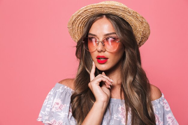 Portrait of a pretty young woman in summer clothes