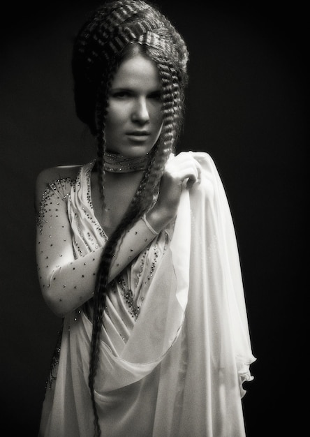 Portrait of pretty young woman with curly hair