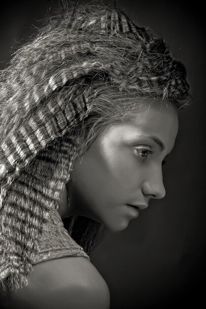 Portrait of pretty young woman with curly hair