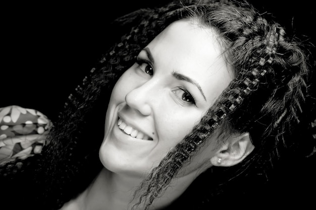 Portrait of pretty young woman with curly hair