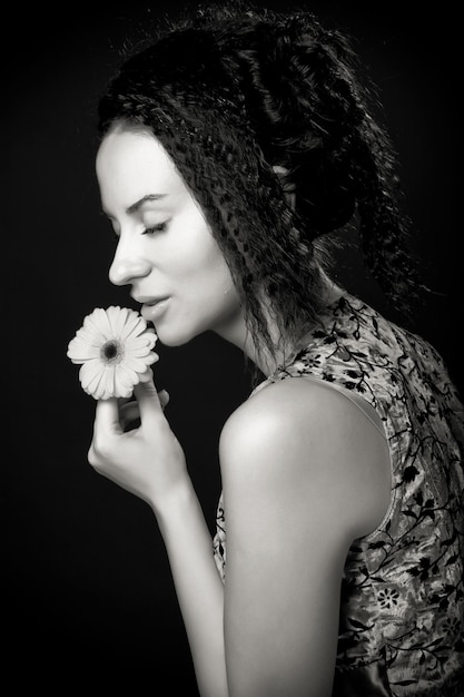 Portrait of pretty young woman with curly hair