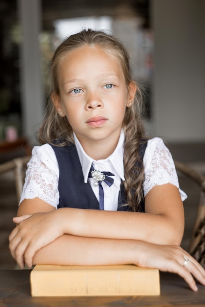 Portrait primary schoolgirl in school uniform