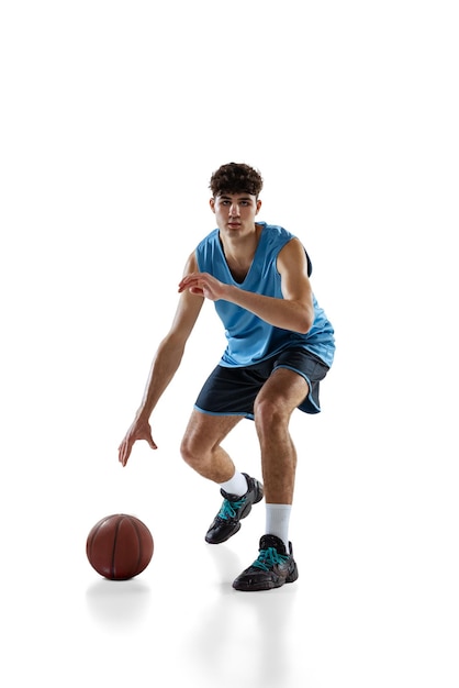 Portrait of professional backetball player training isolated on white