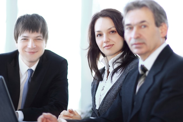 Portrait of a professional business team sitting behind a Desk . photo with copy space