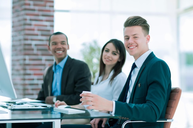 Portrait of a professional business team sitting at Desk