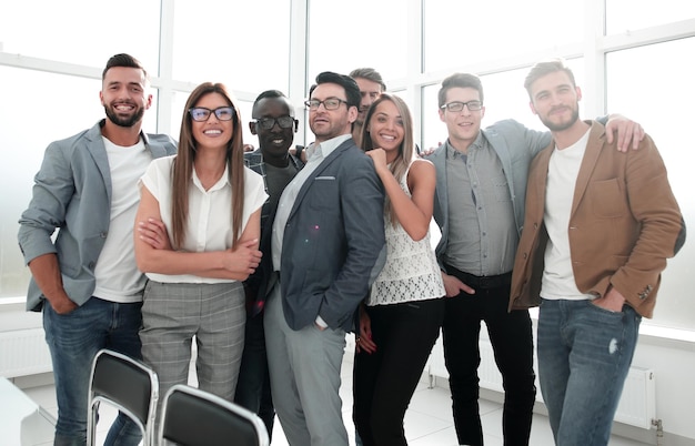 Portrait of a professional business team standing in a modern office photo with copy space